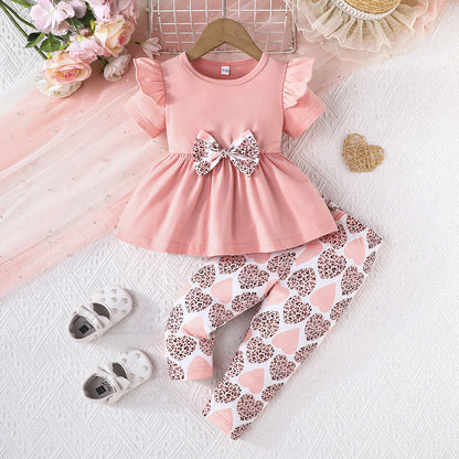 Conjunto con blusa y pantalón estampado para niña