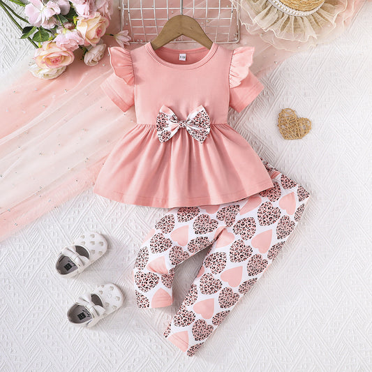 Conjunto con blusa y pantalón estampado para niña