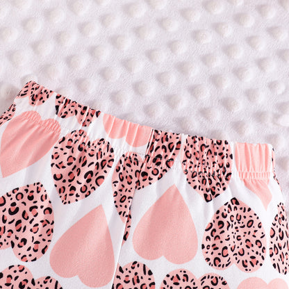 Conjunto con blusa y pantalón estampado para niña